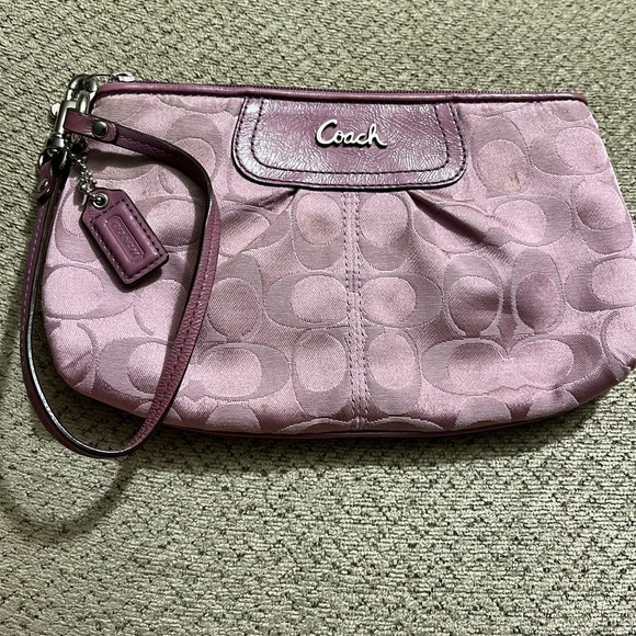 Coach Handbags - Coach wristlet.  EUC. Pinkish/mauve color.  Approximately 8.5 x 5.5